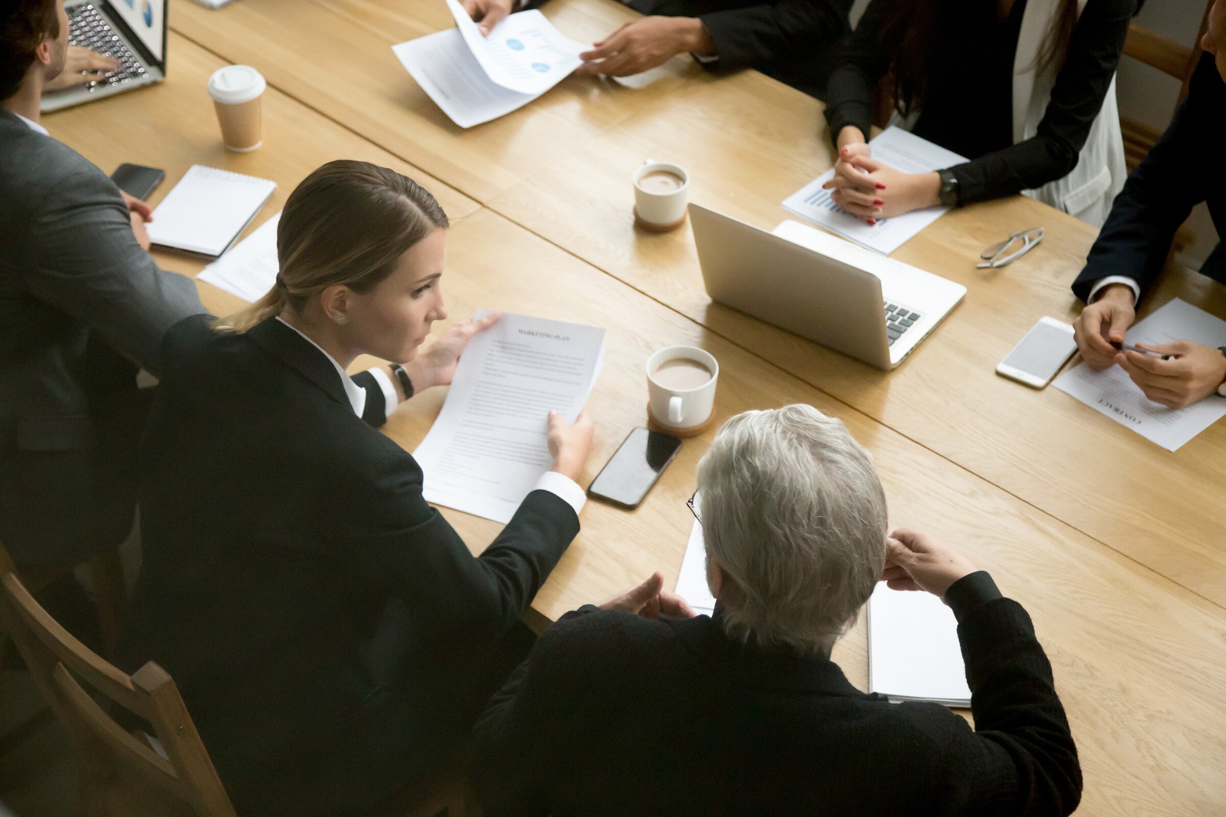 Leaders collaborating around a table